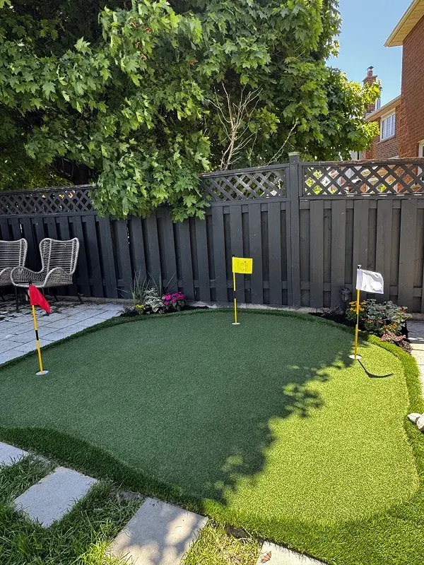 Artificial turf backyard installation Toronto — lush synthetic lawn