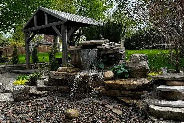 Natural stone waterfall installation GTA Ontario